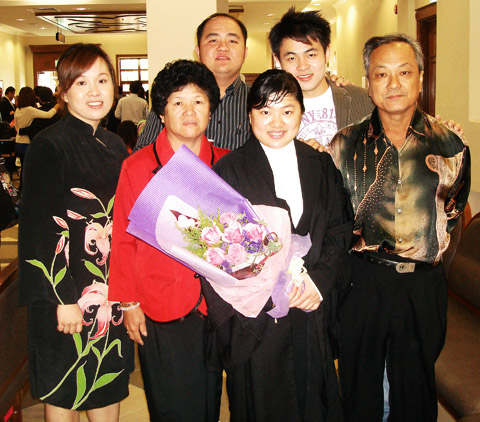 me, my mum, cecilia ( centre with flower), my dad, and my two brothers