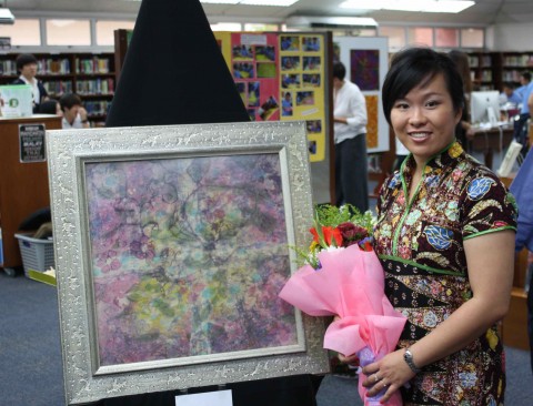 Emilia Tan and her batik painting